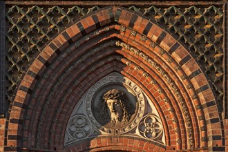 Relief of Christ above the side entrance of the neo-Gothic St. Paul's Church