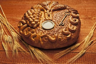 Decorated bread loaf with a key and salt shaker baked into the bread