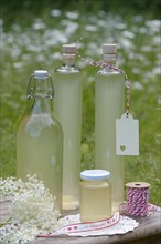 Bottles with elderflower syrup