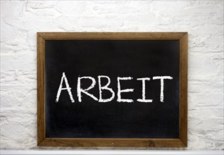 Chalkboard with the word 'Arbeit'