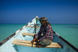 Socotran man sitting in fishing boat