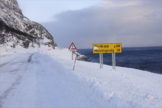 The snow-covered main road E69 on Porsangerfjord