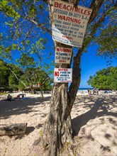 Sign with beach rules on the beach of Frenchmans Cove