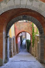 Alley with archways in the old town