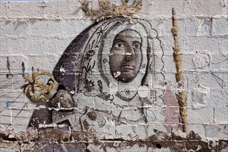 Graffiti with the patron saint of the Canary Islands Virgen de la Candelaria in the pilgrimage town of Candelaria