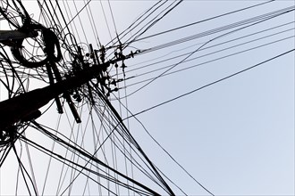 Tangled power cables on a power pole