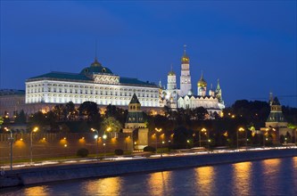 Moscow Kremlin with palace and cathedrals on Moskva River at night