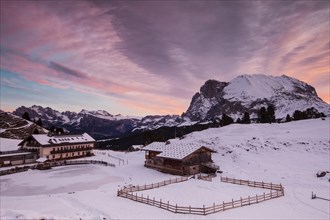 Dawn on Plattkofel and Mahlknechthutte hut in winter