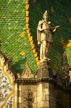 Statue on Zsolnay tiled roof