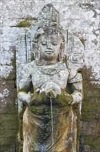Carved granite statue in the ritual bathing pool
