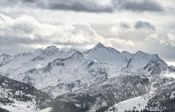 View of snow-covered main Alpine ridge with Grossvenediger
