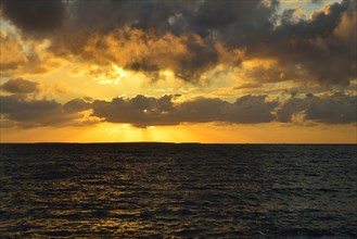 Sunset at sea with clouds