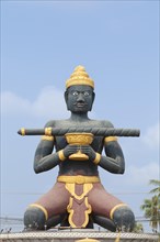 Statue of Ta Dambong with his magic stick
