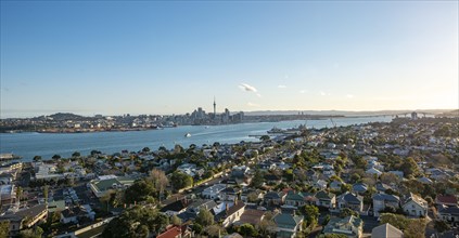 View over the houses of Devonport to the skyline of Auckland with Sky Tower
