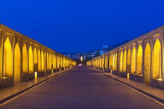 Illuminated Si-o-se Pol Bridge or Allah-Verdi Khan Bridge at dusk