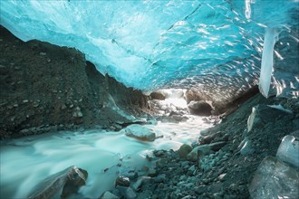 Glacier cave with a stream