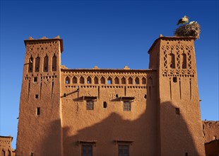 Stork's nest on the mud buildings of the fortified Berber Ksar of Ait Benhaddou