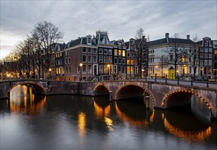 Canal with bridge at dusk