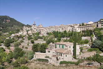 Townscape with Valldemossa Charterhouse and parish church of Sant Bartomeu