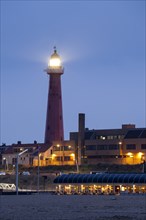 Beach promenade with lighthouse