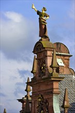 Art Nouveau figure of a woman with golden money bag and securities on the gable of the former country's central bank