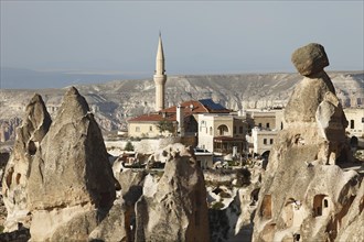 Mosque of Uchisar between cave dwellings and tufa formations