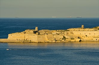 View from Valletta to Ricasoli Fortress on a headland at the Grand Harbour
