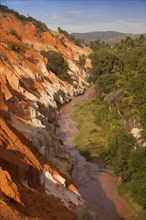 Red sandstone formations of the canyon on Fairy Stream