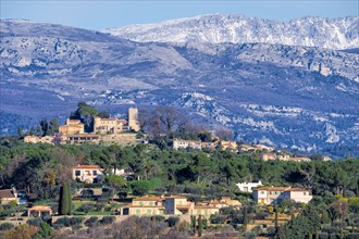 The old village of Mougins and the snow-covered Alpes