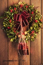 Holly wreath with red packets