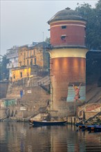 Red water tower on the Ganges riverbank