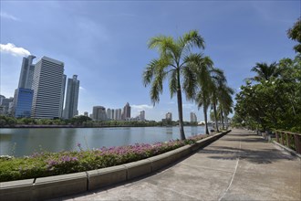 Benjakiti Park with the skyline of Bangkok