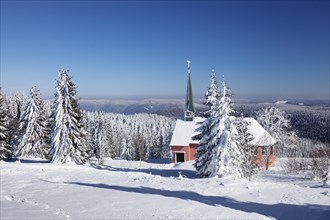 Winter landscape with church on Kandel mountain