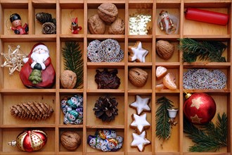 Christmas decorations and sweets in a type case or letter case