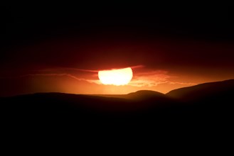 Sunset behind the ash and gas cloud of the Holuhraun fissure eruption