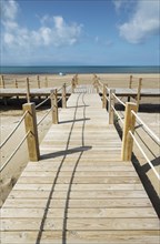 Wooden footbridges at the beach of Riumar