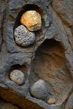 Stone deposit on rock face