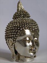 Silver head of a Buddha with eyes closed