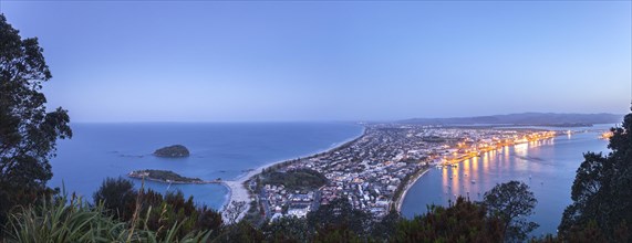 Panoramic view of the town of Mount Maunganui and the Port of Tauranga at nightfall