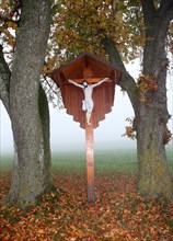 Wayside cross with a figure of Jesus Christ