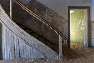 Staircase in an old house in the former diamond town of Kolmanskop