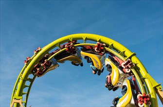Cars of a roller coaster in a looping
