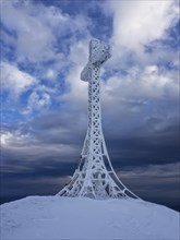 Summit cross covered with hoarfrost