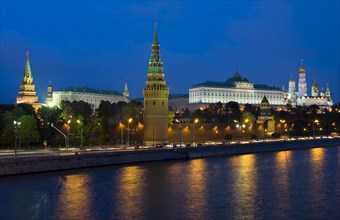 Moscow Kremlin with palace and cathedrals on Moskva River at night
