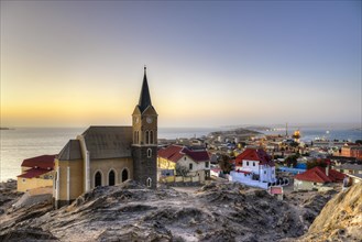 Evening atmosphere above the rock church and the city of Luderitz