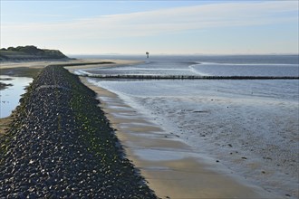 Coastal protection wall made of stones on the western beach