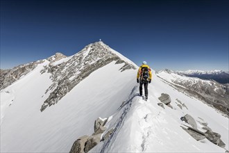 Mountaineer on the summit ridge during the ascent of Mt Hoher Weisszint