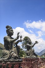 Statues of Devas making offerings at Tian Tan Buddha image at Po Lin Monastery