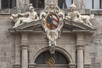 Right portal of the west facade with imperial coat of arms and the many-headed