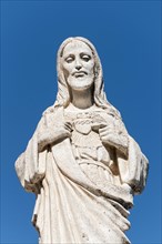 White statue of Jesus Christ outside the Chapel of Virgen de la Pena